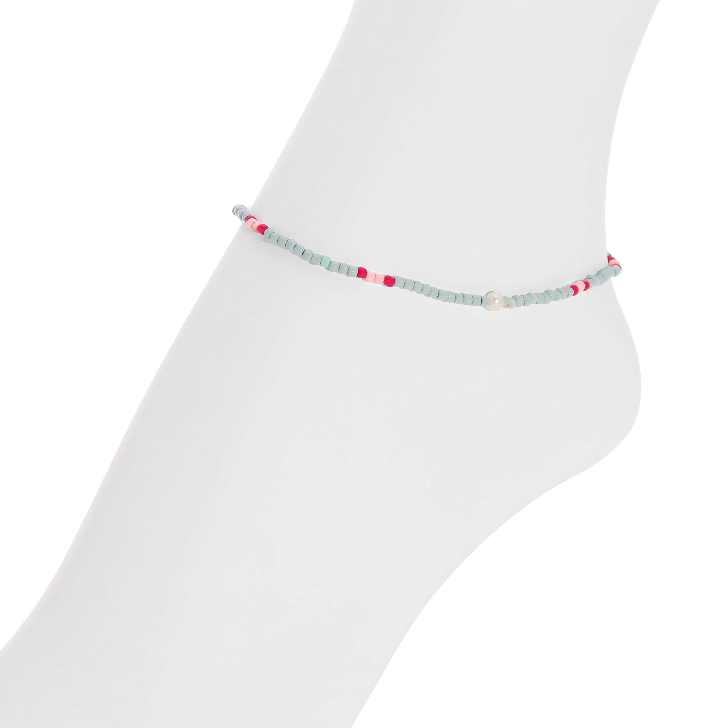A delicate beaded ankle bracelet with light blue, red, and white beads, displayed on a white mannequin foot against a white background.