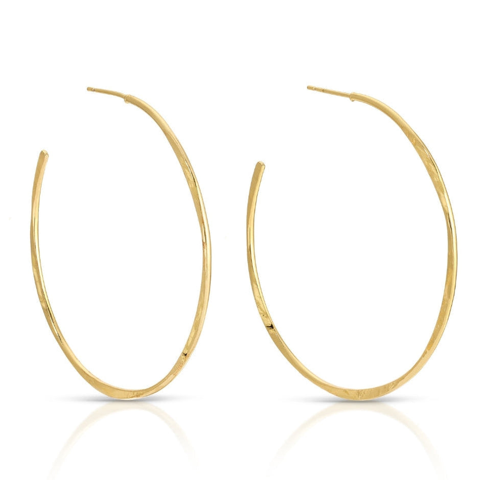Gold hoop earrings on a white background