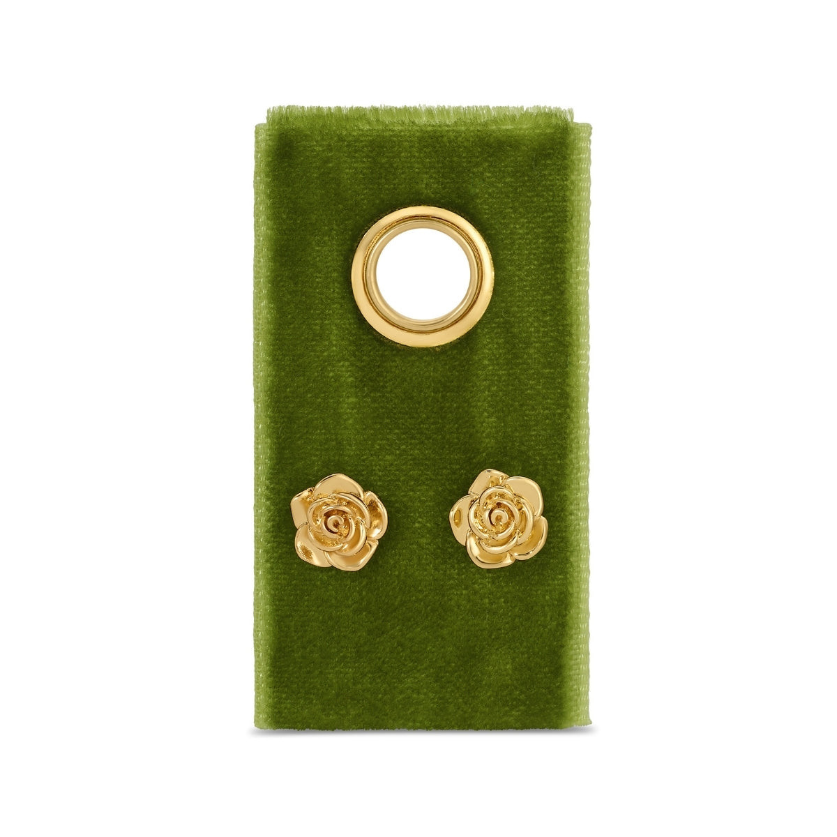 Gold rose-shaped earrings on a green velvet stand with a white background